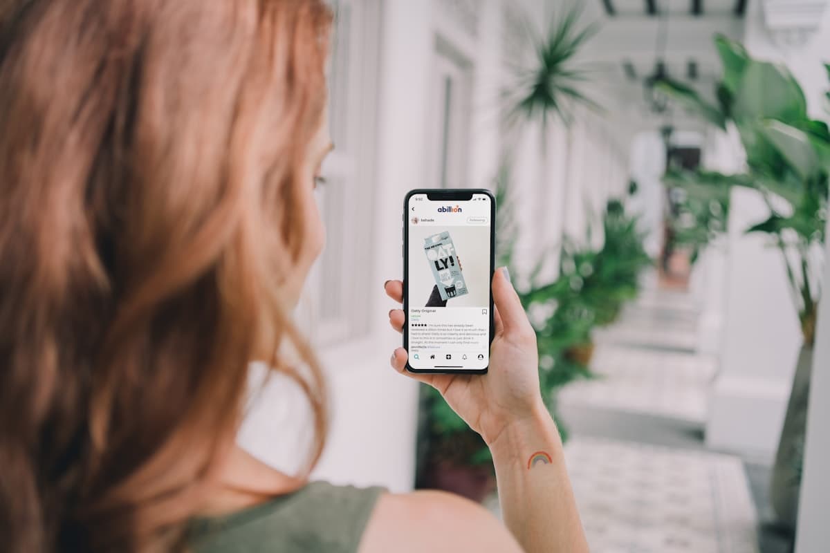 Woman looking at her iPhone screen